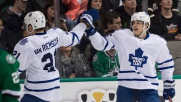 Dec 23, 2014; Dallas, TX, USA; Toronto Maple Leafs left wing James van Riemsdyk (21) and center Mike Santorelli (25) celebrate Santorelli