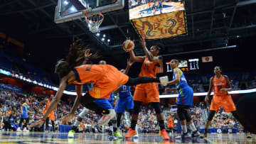 UNCASVILLE, CT - AUGUST 12: Connecticut Sun Guard Courtney Williams (10) dives out of bounds to save the loose ball during the game as the Connecticut Sun host the Dallas Wings on August 12, 2017 at the Mohegan Sun Arena in Uncasville, Connecticut. (Photo by Williams Paul/Icon Sportswire via Getty Images)
