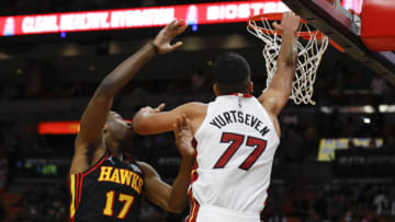Miami Heat center Omer Yurtseven (77) attempts to dunk the ball against Atlanta Hawks forward Onyeka Okongwu (17)(Sam Navarro-USA TODAY Sports)