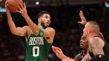 HOUSTON, TEXAS - OCTOBER 24: Jayson Tatum #0 of the Boston Celtics controls the ball against defender Jae'Sean Tate #8 of the Houston Rockets during the first half at Toyota Center on October 24, 2021 in Houston, Texas. NOTE TO USER: User expressly acknowledges and agrees that, by downloading and or using this photograph, User is consenting to the terms and conditions of the Getty Images License Agreement. (Photo by Carmen Mandato/Getty Images)