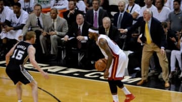 Jun 12, 2014; Miami, FL, USA; Miami Heat forward LeBron James (6) dribbles while defended by San Antonio Spurs forward Matt Bonner (15) as San Antonio Spurs head coach Gregg Popovich coaches during the first quarter of game four of the 2014 NBA Finals at American Airlines Arena. Mandatory Credit: Steve Mitchell-USA TODAY Sports