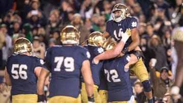 Nov 14, 2015; South Bend, IN, USA; Notre Dame Fighting Irish quarterback DeShone Kizer (14) celebrates after a touchdown in the fourth quarter against the Wake Forest Demon Deacons at Notre Dame Stadium. Notre Dame won 28-7. Mandatory Credit: Matt Cashore-USA TODAY Sports