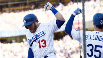 LOS ANGELES, CA - JUNE 09: Max Muncy #13 of the Los Angeles Dodgers celebrates with Cody Bellinger #35 after hitting a home run against pitcher Anibal Sanchez #19 of the Atlanta Braves during the first inning at Dodger Stadium on June 9, 2018 in Los Angeles, California. (Photo by Kevork Djansezian/Getty Images)