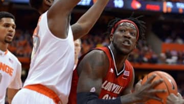 Feb 18, 2015; Syracuse, NY, USA; Louisville Cardinals forward Montrezl Harrell (right) looks to take a shot with Syracuse Orange forward Rakeem Christmas (25) defending during the first half of a game at the Carrier Dome. Mandatory Credit: Mark Konezny-USA TODAY Sports