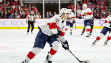 RALEIGH, NC - NOVEMBER 23: Florida Panthers Left Wing Jonathan Huberdeau (11) looks for a shooting lane during an NHL game between the Florida Panthers and the Carolina Hurricanes on November 23, 2019 at the PNC Arena in Raleigh, NC. (Photo by John McCreary/Icon Sportswire via Getty Images)