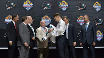 Jun 26, 2015; Sunrise, FL, USA; Timo Meier is presented with a team jersey after being selected as the number nine overall pick to the San Jose Sharks in the first round of the 2015 NHL Draft at BB&T Center. Mandatory Credit: Steve Mitchell-USA TODAY Sports