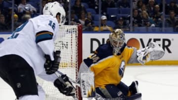 Nov 18, 2014; Buffalo, NY, USA; Buffalo Sabres goalie Michal Neuvirth (34) makes a save on a shot by San Jose Sharks center Patrick Marleau (12) during the first period at First Niagara Center. Mandatory Credit: Kevin Hoffman-USA TODAY Sports