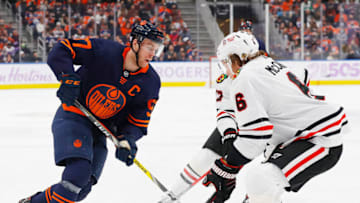Edmonton Oilers forward Connor McDavid (97) carries the puck against Chicago Blackhawks defensemen Jake McCabe (6) Mandatory Credit: Perry Nelson-USA TODAY Sports