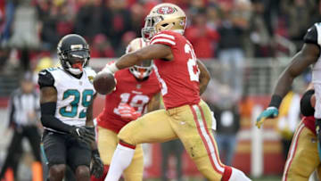 SANTA CLARA, CA - DECEMBER 24: Carlos Hyde #28 of the San Francisco 49ers rushes for a touchdown against the Jacksonville Jaguars during their NFL football game at Levi's Stadium on December 24, 2017 in Santa Clara, California. (Photo by Thearon W. Henderson/Getty Images)