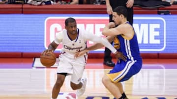 May 3, 2014; Los Angeles, CA, USA; Los Angeles Clippers guard Chris Paul (3) moves the ball defended by Golden State Warriors guard Klay Thompson (11) during the fourth quarter in game seven of the first round of the 2014 NBA Playoffs at Staples Center. The Los Angeles Clippers defeated the Golden State Warriors 126-121. Mandatory Credit: Kelvin Kuo-USA TODAY Sports