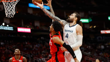 Mar 20, 2022; Houston, Texas, USA; Houston Rockets center Christian Wood (35) attempts to get a rebound away from Memphis Grizzlies center Steven Adams (4) during the first quarter at Toyota Center. Mandatory Credit: Troy Taormina-USA TODAY Sports
