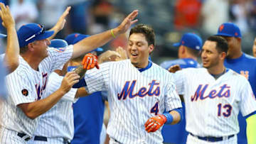 NEW YORK, NY - JULY 09: Wilmer Flores #4 of the New York Mets celebrates after hitting a game-winning, walk-off home run in the 10th inning against the Philadelphia Phillies during Game One of a doubleheader at Citi Field on July 9, 2018 in the Flushing neighborhood of the Queens borough of New York City. (Photo by Mike Stobe/Getty Images)