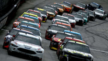 BRISTOL, TN - APRIL 16: Jimmie Johnson, driver of the #48 Lowe's for Pros Chevrolet, and Brad Keselowski, driver of the #2 Discount Tire Ford, lead the field to a restart during the rain delayed Monster Energy NASCAR Cup Series Food City 500 at Bristol Motor Speedway on April 16, 2018 in Bristol, Tennessee. (Photo by Sean Gardner/Getty Images)