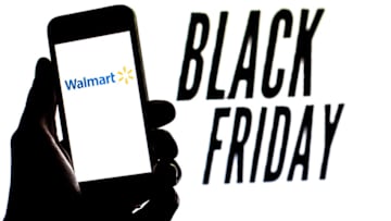 SPAIN - 2021/11/16: In this photo illustration, a Walmart logo is seen on a smartphone screen with 'Black Friday' words in the background. (Photo Illustration by Thiago Prudêncio/SOPA Images/LightRocket via Getty Images)