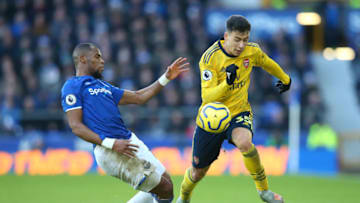LIVERPOOL, ENGLAND - DECEMBER 21: Djibril Sidibe of Everton tackles Gabriel Martinelli of Arsenal during the Premier League match between Everton FC and Arsenal FC at Goodison Park on December 21, 2019 in Liverpool, United Kingdom. (Photo by Alex Livesey/Getty Images)