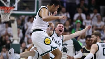 EAST LANSING, MICHIGAN - JANUARY 08: Kenny Goins #25 of the Michigan State Spartans celebrates after a second half timeout was called with Foster Loyer #3 while playing the Purdue Boilermakers at Breslin Center on January 08, 2019 in East Lansing, Michigan. Michigan State won the game 77-59. (Photo by Gregory Shamus/Getty Images)