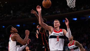 NEW YORK, NEW YORK - MARCH 18: Kristaps Porzingis #6 of the Washington Wizards and Mitchell Robinson #23 of the New York Knicks go up for a rebound during the second half of the game at Madison Square Garden on March 18, 2022 in New York City. NOTE TO USER: User expressly acknowledges and agrees that, by downloading and or using this photograph, User is consenting to the terms and conditions of the Getty Images License Agreement. (Photo by Dustin Satloff/Getty Images)