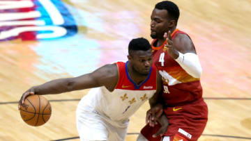 Zion Williamson #1 of the New Orleans Pelicans is defended by Paul Millsap #4 of the Denver Nuggets (Photo by Sean Gardner/Getty Images)