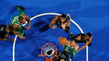 DETROIT, MI - FEBRUARY 23: Daniel Theis #27 of the Boston Celtics grabs the rebound against the Detroit Pistons on February 23, 2018 at Little Caesars Arena in Detroit, Michigan. NOTE TO USER: User expressly acknowledges and agrees that, by downloading and/or using this photograph, User is consenting to the terms and conditions of the Getty Images License Agreement. Mandatory Copyright Notice: Copyright 2018 NBAE (Photo by Chris Schwegler/NBAE via Getty Images)