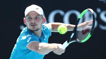 MELBOURNE, AUSTRALIA - JANUARY 18: David Goffin of Belgium plays a backhand in his second round match against Julien Benneteau of France on day four of the 2018 Australian Open at Melbourne Park on January 18, 2018 in Melbourne, Australia. (Photo by Ryan Pierse/Getty Images)