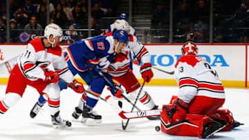NEW YORK, NEW YORK - NOVEMBER 24: Anders Lee #27 of the New York Islanders is stopped by Scott Darling #33 of the Carolina Hurricanes at Barclays Center on November 24, 2018 in the Brooklyn borough of New York City. (Photo by Mike Stobe/NHLI via Getty Images)