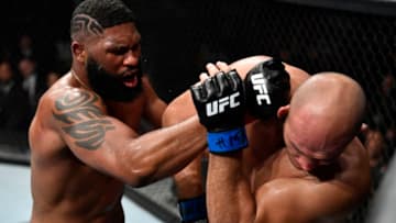 RALEIGH, NORTH CAROLINA - JANUARY 25: (L-R) Curtis Blaydes punches Junior Dos Santos of Brazil in their heavyweight fight during the UFC Fight Night event at PNC Arena on January 25, 2020 in Raleigh, North Carolina. (Photo by Jeff Bottari/Zuffa LLC via Getty Images)