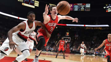 Nov 25, 2016; Portland, OR, USA; Portland Trail Blazers forward Maurice Harkless (4) and New Orleans Pelicans center Omer Asik (3) pursue a loose ball during the third quarter at Moda Center at the Rose Quarter. The Blazers won 119-104. Mandatory Credit: Steve Dykes-USA TODAY Sports
