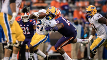 Nov 28, 2020; Clemson, SC, USA; Clemson defensive tackle Tyler Davis (13) tackles Pittsburgh running back A.J. Davis (21) during the second quarter of the game against Pittsburgh at Memorial Stadium. Mandatory Credit: Ken Ruinard-USA TODAY Sports