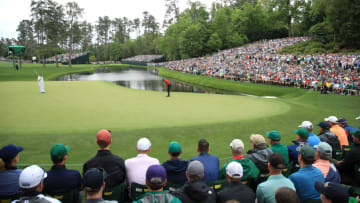 AUGUSTA, GEORGIA - APRIL 14: Tiger Woods of the United States putts for birdie on the 16th green as patrons look on during the final round of the Masters at Augusta National Golf Club on April 14, 2019 in Augusta, Georgia. (Photo by Andrew Redington/Getty Images)