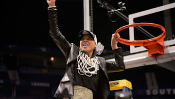 NASHVILLE, TN - MARCH 04: South Carolina Gamecocks head coach Dawn Staley celebrates with the team in cutting down the net after winning the SEC championship during the fourth period between the South Carolina Gamecocks and the Mississippi State Lady Bulldogs in a SEC Women's Tournament game on on March 4, 2018, at Bridgestone Arena in Nashville, TN. (Photo by Steve Roberts/Icon Sportswire via Getty Images)