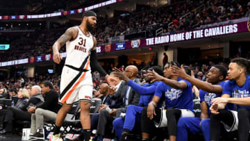 CLEVELAND, OHIO - FEBRUARY 09: Marcus Morris Sr. #31 of the LA Clippers celebrates with his new teammates as he leaves the game during the second half against the Cleveland Cavaliers at Rocket Mortgage Fieldhouse on February 09, 2020 in Cleveland, Ohio. The Clippers defeated the Cavaliers 133-92. NOTE TO USER: User expressly acknowledges and agrees that, by downloading and/or using this photograph, user is consenting to the terms and conditions of the Getty Images License Agreement. (Photo by Jason Miller/Getty Images)