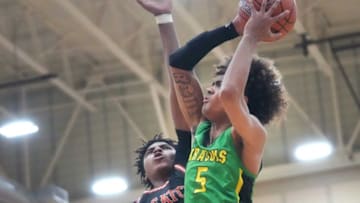 South Carolina basketball signee Collin Murray-Boyles blocks Vyctorius Miller's shot at Chaparral High School. Mandatory Credit: Joe Rondone-Arizona Republic