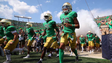 SOUTH BEND, INDIANA - SEPTEMBER 17: Hakim Sanfo #35 and Xavier Watts #26 of the Notre Dame Fighting Irish take the field against the California Golden Bears during the first half at Notre Dame Stadium on September 17, 2022 in South Bend, Indiana. (Photo by Michael Reaves/Getty Images)