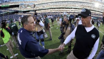 Oct 20, 2013; East Rutherford, NJ, USA; New York Jets head coach Rex Ryan (right) and New England Patriots head coach Bill Belichick shake hands after the game at MetLife Stadium. The Jets won the game 30-27 in overtime. Mandatory Credit: Joe Camporeale-USA TODAY Sports