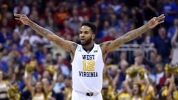Mar 11, 2016; Kansas City, MO, USA; West Virginia Mountaineers guard Tarik Phillip (12) celebrates after a three point score against the Oklahoma Sooners in the first half during the Big 12 Conference tournament at Sprint Center. Mandatory Credit: Denny Medley-USA TODAY Sports