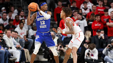 Memphis Tigers forward DeAndre Williams is defended by Cincinnati Bearcats forward Jeremiah Davenport at Fifth Third Arena. Getty Images.