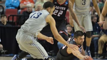 Mar 19, 2015; Portland, OR, USA; Eastern Washington Eagles forward Venky Jois (right) dives for the basketball against Georgetown Hoyas forward Paul White (13) during the second half in the second round of the 2015 NCAA Tournament at Moda Center. Mandatory Credit: Kirby Lee-USA TODAY Sports