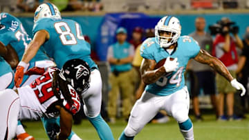 Aug 25, 2016; Orlando, FL, USA; Miami Dolphins running back Arian Foster (34) carries the ball against the Atlanta Falcons at Camping World Stadium. Mandatory Credit: Steve Mitchell-USA TODAY Sports