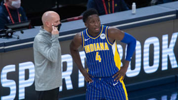 Jan 9, 2021; Indianapolis, Indiana, USA; Indiana Pacers head coach Nate Bjorkgren talks with guard Victor Oladipo (4) during a free throw in the fourth quarter against the Phoenix Suns at Bankers Life Fieldhouse. Mandatory Credit: Trevor Ruszkowski-USA TODAY Sports