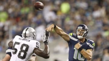 Aug 29, 2013; Seattle, WA, USA; Seattle Seahawks quarterback Brady Quinn (10) passes against the Oakland Raidersduring the second half at CenturyLink Field. Mandatory Credit: Joe Nicholson-USA TODAY Sports