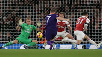 Liverpool's English midfielder James Milner (C) scores his team's first goal during the English Premier League football match between Arsenal and Liverpool at the Emirates Stadium in London on November 3, 2018. (Photo by Daniel LEAL-OLIVAS / AFP) / RESTRICTED TO EDITORIAL USE. No use with unauthorized audio, video, data, fixture lists, club/league logos or 'live' services. Online in-match use limited to 120 images. An additional 40 images may be used in extra time. No video emulation. Social media in-match use limited to 120 images. An additional 40 images may be used in extra time. No use in betting publications, games or single club/league/player publications. / (Photo credit should read DANIEL LEAL-OLIVAS/AFP/Getty Images)