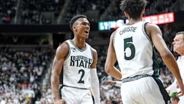 Michigan State's Tyson Walker, left, celebrates with Max Christie after Christie was fouled by Illinois on a shot during the first half Saturday, Feb. 19, 2022, at the Breslin Center in East Lansing.Syndication Lansing State Journal