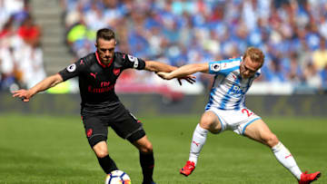 HUDDERSFIELD, ENGLAND - MAY 13: Aaron Ramsey of Arsenal battles for possession with Alex Pritchard of Huddersfield Town during the Premier League match between Huddersfield Town and Arsenal at John Smith's Stadium on May 13, 2018 in Huddersfield, England. (Photo by Catherine Ivill/Getty Images)