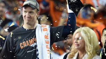 Feb 7, 2016; Santa Clara, CA, USA; Denver Broncos quarterback Peyton Manning (18) hoists the Vince Lombardi Trophy after defeating the Carolina Panthers in Super Bowl 50 at Levi
