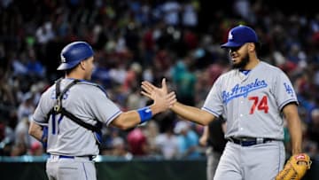 Jun 15, 2016; Phoenix, AZ, USA; Los Angeles Dodgers relief pitcher Kenley Jansen (74) celebrates with catcher A.J. Ellis (17) after beating the Arizona Diamondbacks 3-2 at Chase Field. Mandatory Credit: Matt Kartozian-USA TODAY Sports
