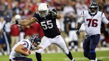 Nov 10, 2013; Phoenix, AZ, USA; Arizona Cardinals outside linebacker John Abraham (55) sacks Houston Texans quarterback Case Keenum (7) during the game at University of Phoenix Stadium. Arizona won 27-24. Mandatory Credit: Kevin Jairaj-USA TODAY Sports