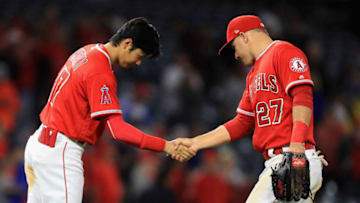 ANAHEIM, CA - MAY 10: Shohei Ohtani #17 shakes hands with Mike Trout #27 of the Los Angeles Angels of Anaheim after defeating the Minnesota Twins 7-4 in a game at Angel Stadium on May 10, 2018 in Anaheim, California. (Photo by Sean M. Haffey/Getty Images)