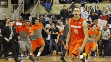 Feb 12, 2014; Pittsburgh, PA, USA; Syracuse Orange guard Tyler Ennis (11) and the Orange bench react after Ennis shoots a three point basket to defeat the Pittsburgh Panthers at the Petersen Events Center. Syracuse won 58-56. Mandatory Credit: Charles LeClaire-USA TODAY Sports