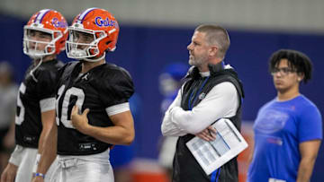 Florida Gators head coach Billy Napier, right, keeps an eye on quarterback drills at Gary Condron Family Indoor Practice Facility in Gainesville, FL on Wednesday, August 9, 2023. [Alan Youngblood/Gainesville Sun]
