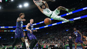 Nov 28, 2022; Boston, Massachusetts, USA; Boston Celtics forward Jayson Tatum (0) makes the basket against the Charlotte Hornets in the second half at TD Garden. Mandatory Credit: David Butler II-USA TODAY Sports